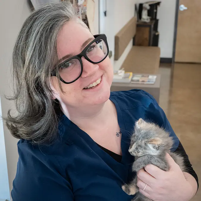 Dr. Sarah Collette holding a kitten